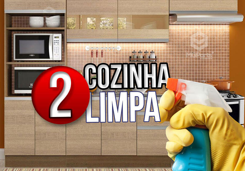 Imagem de uma cozinha planejada, com uma mão segurando um produto de limpeza.